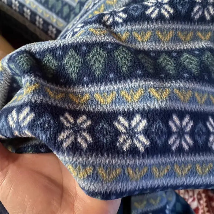 Tissu en polaire à motifs flocons au mètre