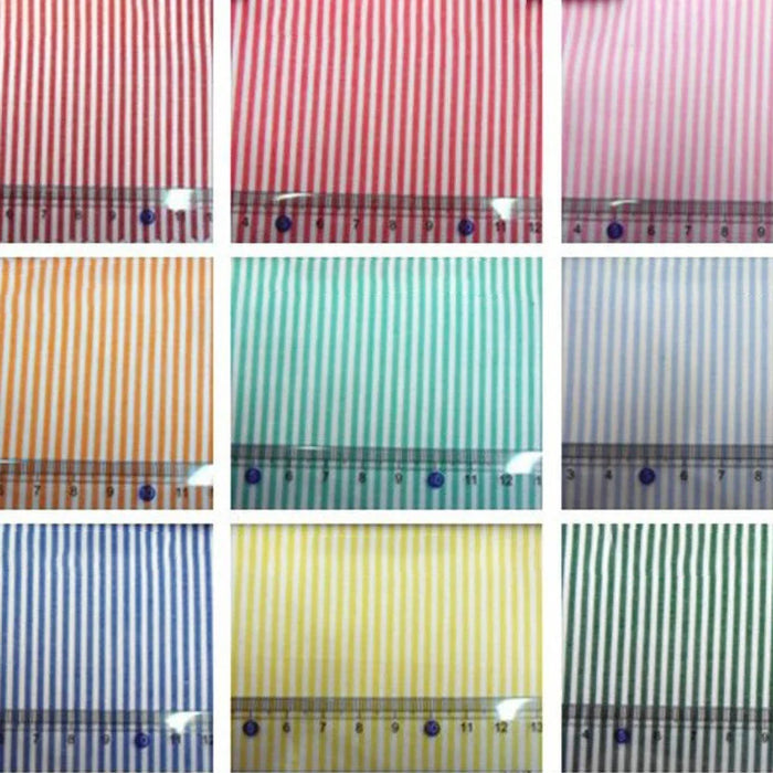 Neuf échantillons de popeline de coton rayée teintée au fil de Longan Craft France, présentés avec une règle pour l'échelle. Ces tissus 100 % coton en rouge, rose, orange, vert, bleu, jaune et mélanges vibrants sont parfaits pour les chemises, les robes et les nappes.