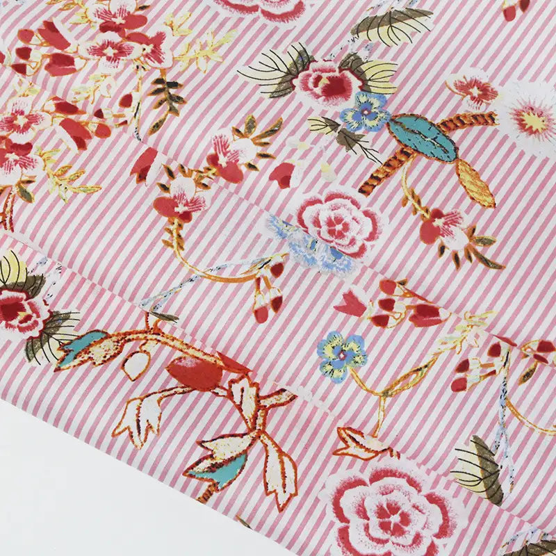 Tissu voile de coton rayé à fleurs au mètre
